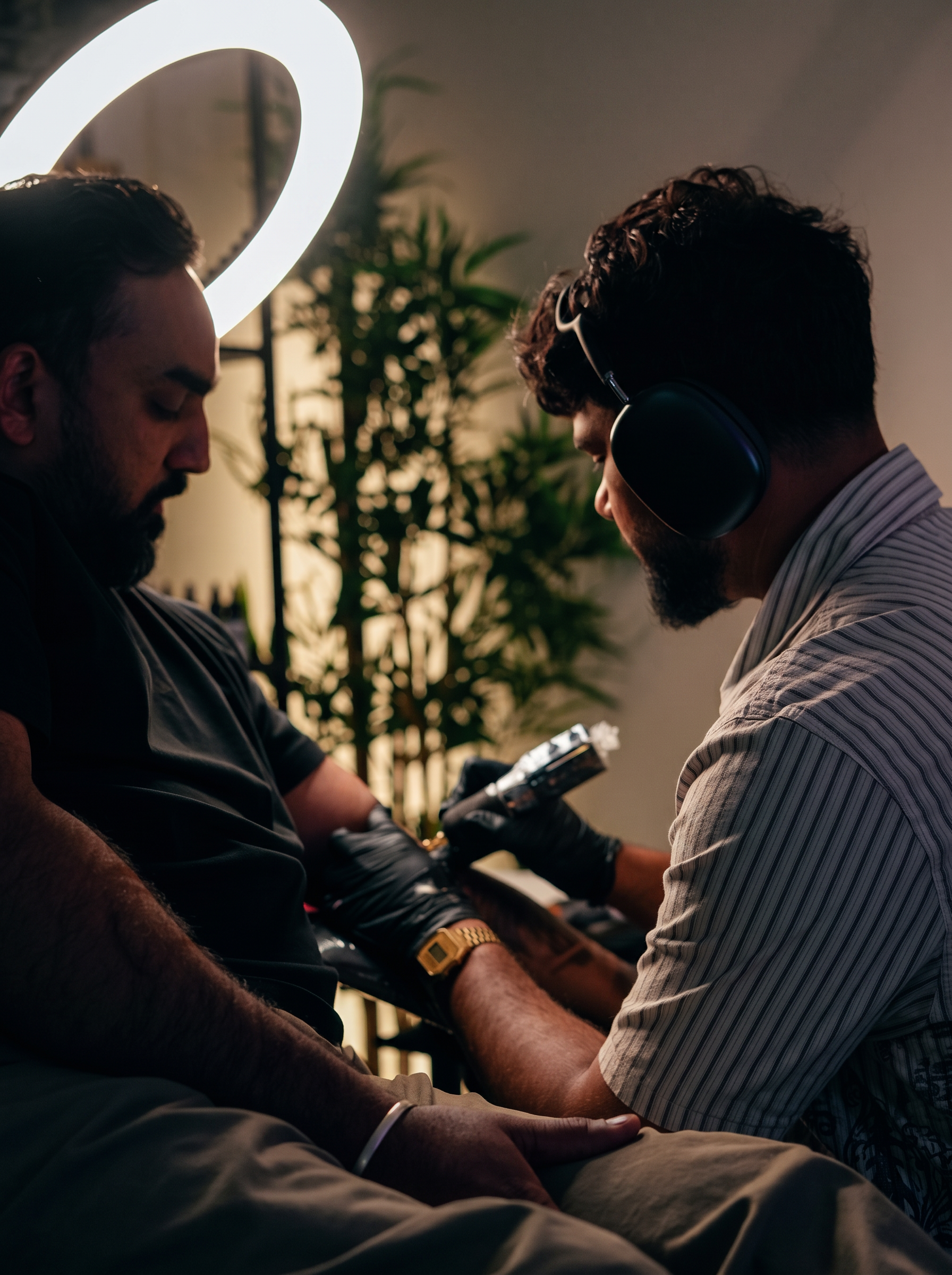 Sahil tattooing in his Winnipeg studio