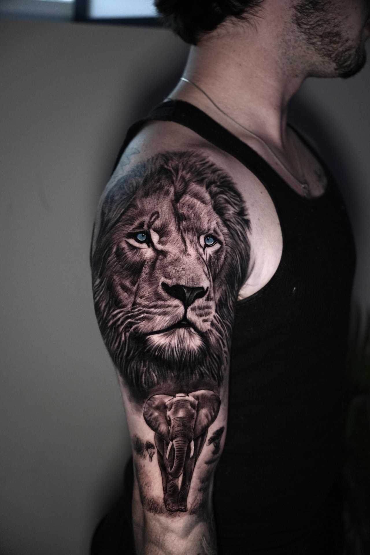 Lion & Walking Elephant — Animal Portraits tattoo by Sahil